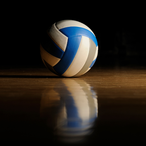 a volleyball sits on a volleyball court