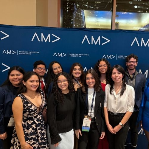 Members of the university of houston-downtown's american marketing association smile at the ama's collegiate conference and competition in chicago
